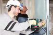 Tradesmen installing drywall