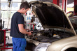 Mechanic Servicing Car