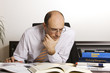 Foto: Male professional studying books Male professional studying books