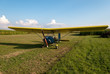 Small microlight aircarft parked in an airfield.