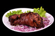 Roast pork  on plate with red onion and green salad