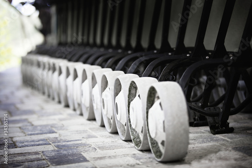 Photo: Golf buggies in a row. Golf buggies in a row.