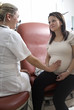 Pregnant woman with doctor