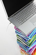 Photo: Laptop on top connected to book stack Laptop on top connected to book stack