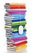 Computer mouse hanging from top of rainbow-colored book stack