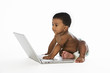 Adorable baby looking at laptop screen