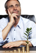 Smiling businessman being happy about prosperous business growth