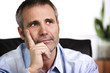 Close-up of confident business person resting chin on hand and l