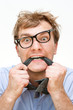 crazy businessman with a tie in the mouth