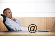 Foto: Ofifce manager contemplating about E-commerce opportunities. Ofifce manager contemplating about E-commerce opportunities.