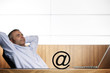 Foto: Ofifce manager contemplating about E-commerce opportunities. Ofifce manager contemplating about E-commerce opportunities.