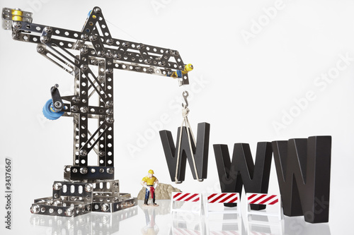 Photo: WWW with crane and worker. WWW with crane and worker.
