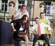 Office chair race at work. Office chair race at work.