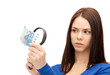 woman with magnifying glass and euro cash money