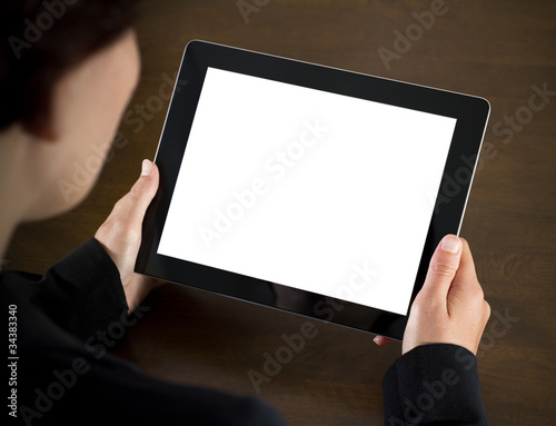 Photo: Business Woman Holding Blank Tablet PC Business Woman Holding Blank Tablet PC