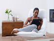 woman using tablet pc at home