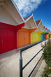 Foto: Row of beach huts on bright summer day Row of beach huts on bright summer day