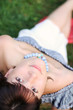 Attractive young woman lying on the grass. Attractive young woman lying on the grass.
