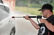 man  washing car