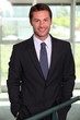 Banker standing in agency