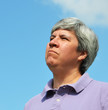 middle-aged woman looking skyward