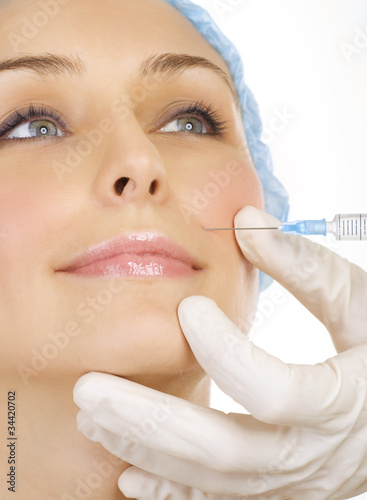 Photo: Woman gets cosmetic injection of botox. Beauty Treatment Woman gets cosmetic injection of botox. Beauty Treatment