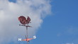 Weathercock and blue sky background
