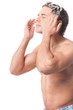Young man wash face