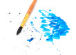 brush with blue paint stroke and stick,