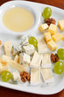 Cheese plate with grapes and honey Cheese plate with grapes and honey
