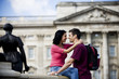 Photo: A young couple in front of Buckingham Palace A young couple in front of Buckingham Palace