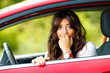 Young pretty woman in the red car Young pretty woman in the red car