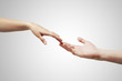 male and female hands (palms) stretch to each other male and female hands (palms) stretch to each other