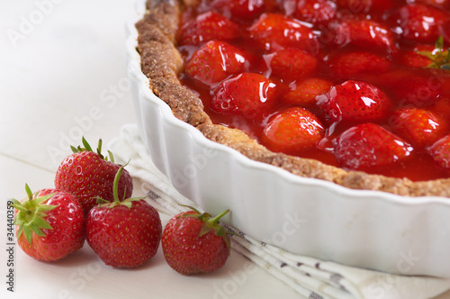 Photo: sweet strawberry pie on a white table sweet strawberry pie on a white table