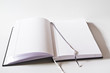 Foto: Aufgeschlagenes Buch mit Lesebändchen Aufgeschlagenes Buch mit Lesebändchen