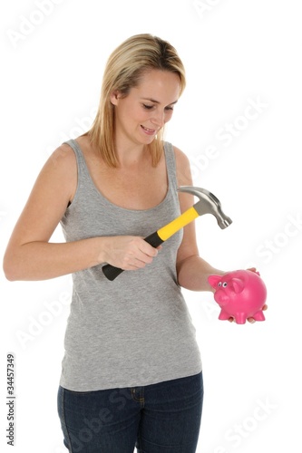 Photo: Girl Opening Piggy Bank with Hammer Girl Opening Piggy Bank with Hammer