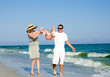 Family having fan at the beach