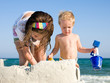 Child Building Sandcastle on a Beach