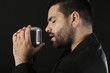 Portrait of male  singer  with old fashioned microphone