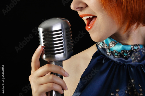 Photo: Retro redhead female singer Retro redhead female singer