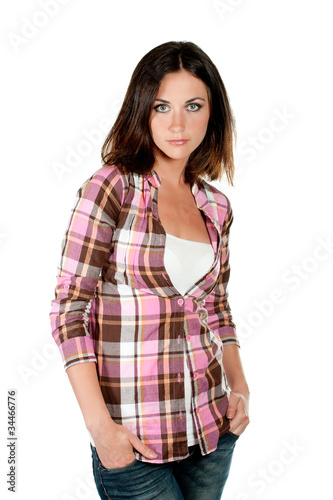 Photo: beautiful young serious woman on a white background beautiful young serious woman on a white background
