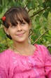 Russian girl stands near the birch