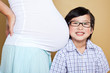 Photo: Asian boy listening to her pregnant mom belly Asian boy listening to her pregnant mom belly