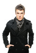 poirtrait of young serious man wearing raincoat