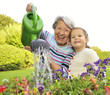 Grandma & Granddaughter Watering Flowers 3