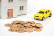 Toy car and house with coins Toy car and house with coins