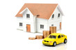 Toy car and house with coins Toy car and house with coins