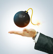 Bomb on businessman's hand Bomb on businessman's hand