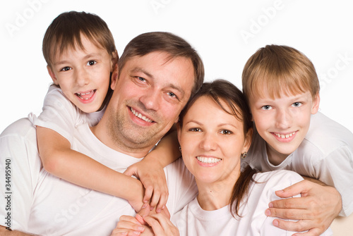 Photo: happy family on a white happy family on a white