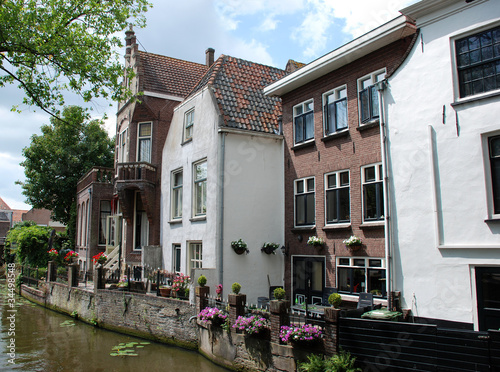 Photo: Houses along a canal in The Netherlands. Houses along a canal in The Netherlands.
